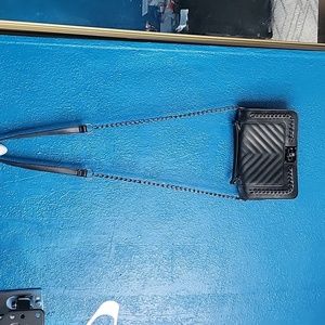 A black chain cross body black bag